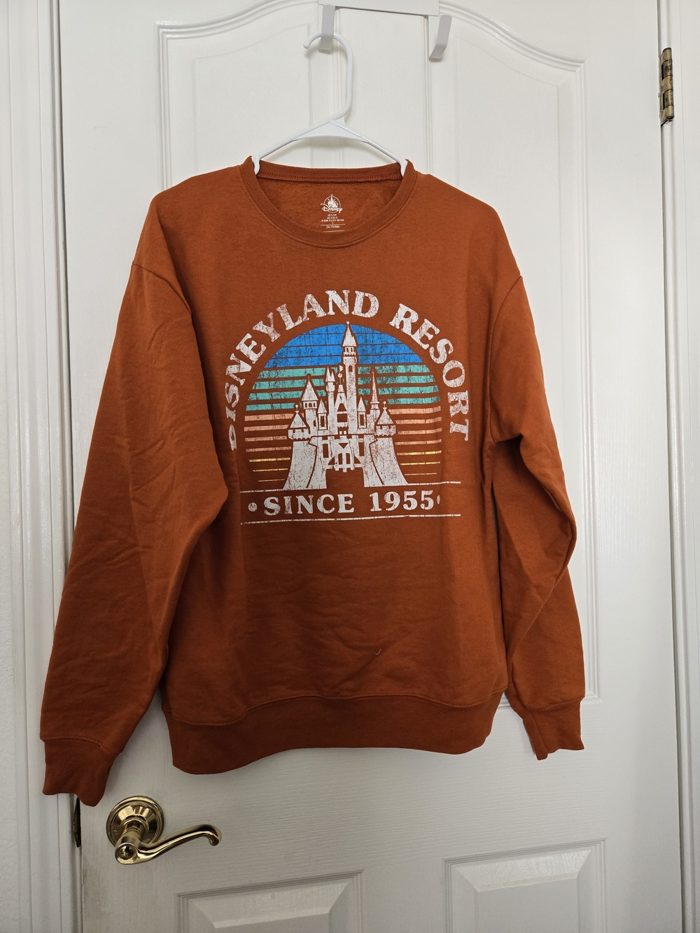 Disney Orange Crewneck Sweatshirt with Retro Castle Graphic